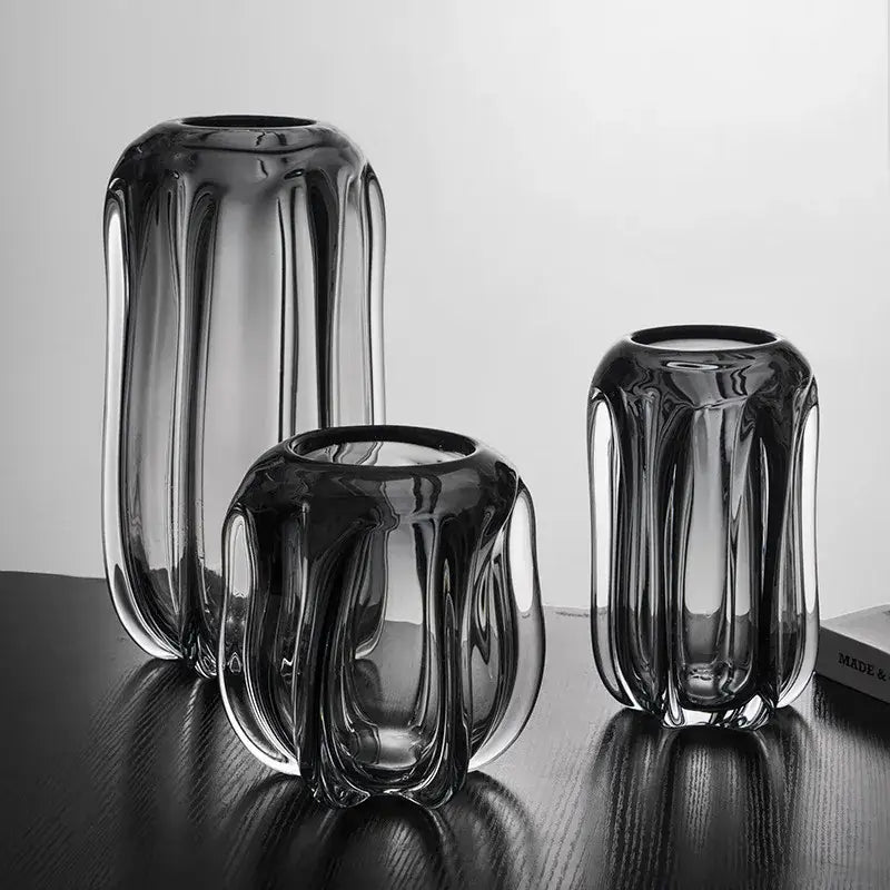 Set of three decorbites glass vases with dark tinted, vertical ridged textures and glossy finish for home decor accent