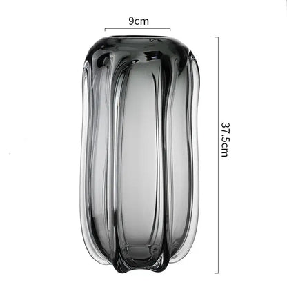 A sleek dark gray glass vase with vertical ridges and reflective surface by DecorBites glass vase for home decor