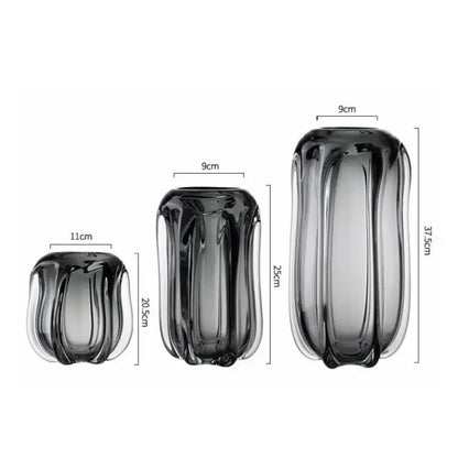 Set of three sleek ribbed decorbites glass vases in dark gray to translucent hues for hydroponics and flower arrangement
