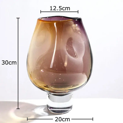 A tall slender decorbites glass vase with amber to deep purple gradient and clear crystal base for hydroponics plant use