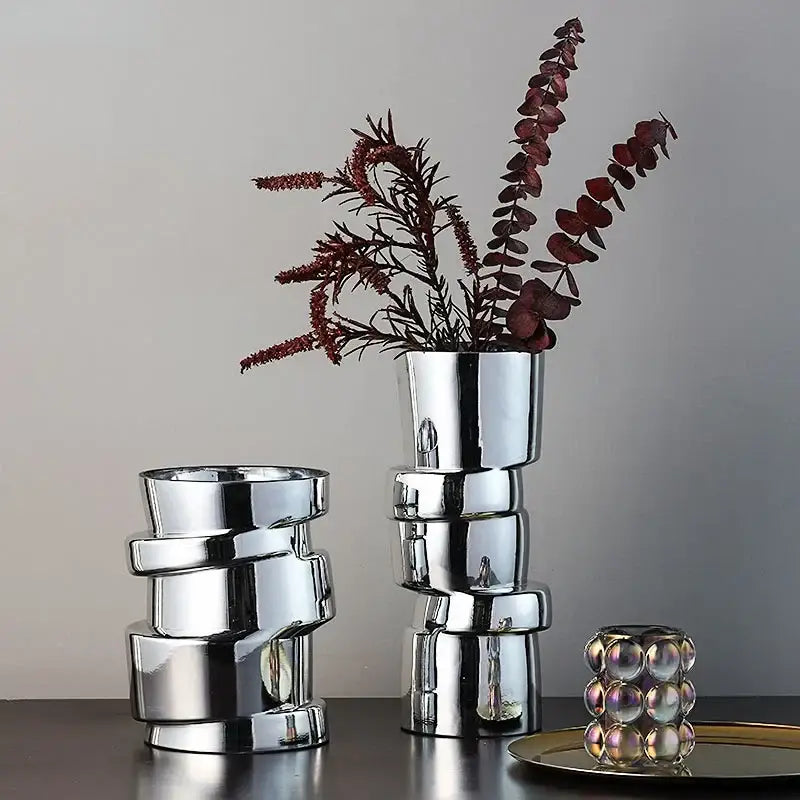 Shiny metallic decorbites glass vase with twist shape and reflective chrome finish for hydroponics decoration