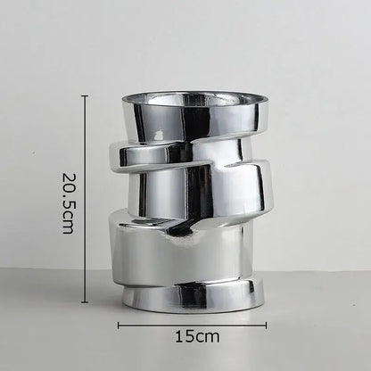 Shiny chrome-finished decorbites glass vase in twist shape with stacked ceramic cylindrical segments for terrarium decor