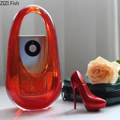 Vibrant red translucent acrylic handbag with sleek modern design complements decorbites glass vase terrarium accessories