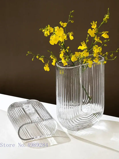 Clear decorbites glass vase with vertical ridges and modern curved design for home and wedding decoration