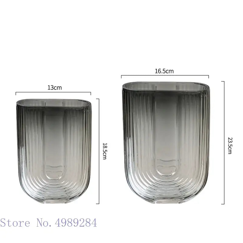 Two sleek ribbed decorbites glass vases with gradient gray to clear finish for modern home and wedding decoration