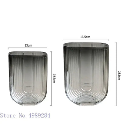 Two sleek ribbed decorbites glass vases with gradient gray to clear finish for modern home and wedding decoration