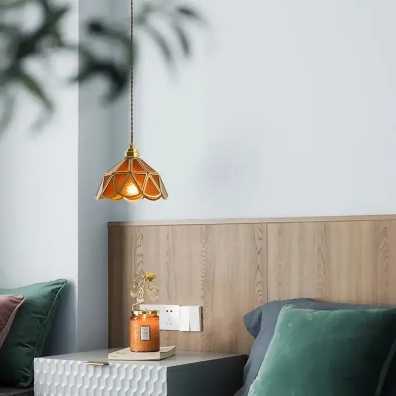 A warm amber glass vintage pendant light with brass frame from decorbites glass vintage pendant lights collection