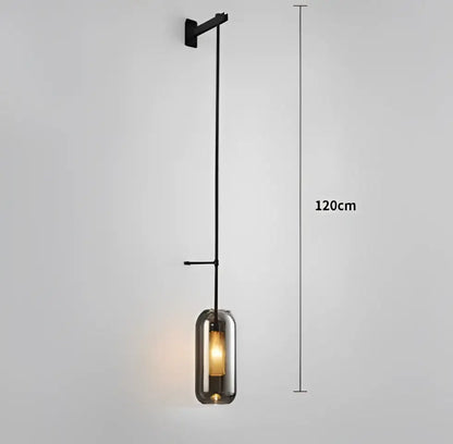 Black metal glass wall art light with tall slender design and smoked glass shade for modern loft decor