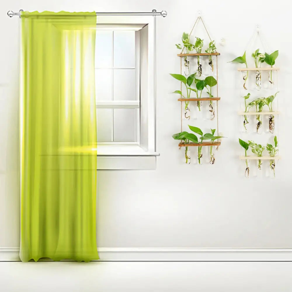 Vibrant lime green sheer curtain beside decorbites™ glass wall hanging planters with wooden holder and test tubes