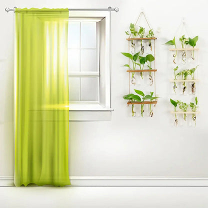 Vibrant lime green sheer curtain beside decorbites™ glass wall hanging planters with wooden holder and test tubes