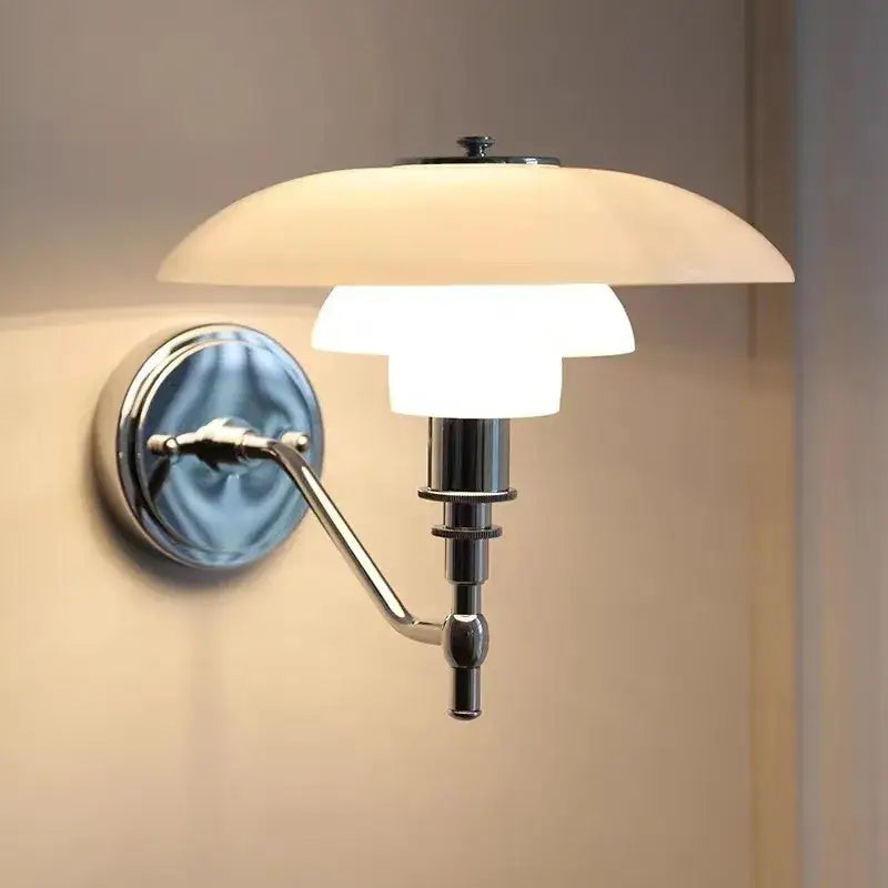 Chrome finished decorbites glass wall lamp with layered frosted glass shade emitting warm light for living room decor
