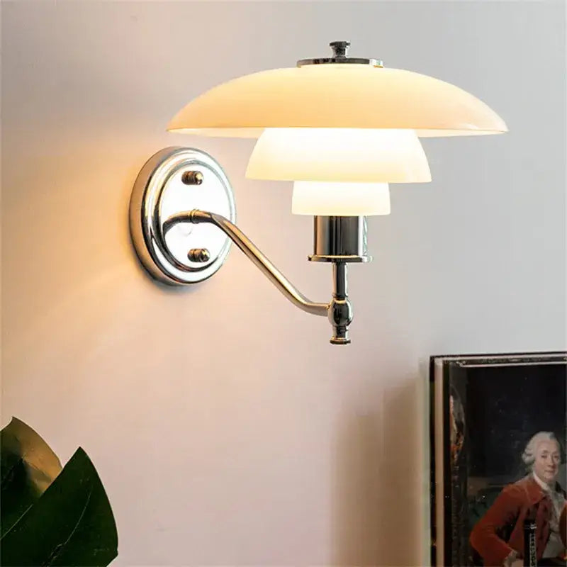 Chrome-finished decorbites glass wall lamp with three stacked off-white translucent shades for living room decor