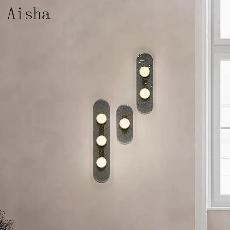 Set of three DecorBites glass wall lamp sconces with textured dark gray finish and circular white glass light fixtures