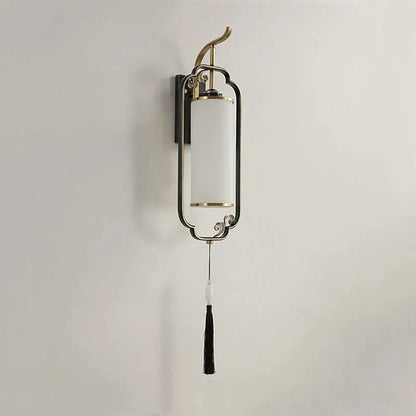 A sleek decorbites glass wall lamp with brass metal frame and off-white glass shade for living room and bedroom