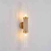 Gold-toned DecorBites glass wall lamp with textured cylindrical iron body and clear glass tubes LED light for home decor and illumination