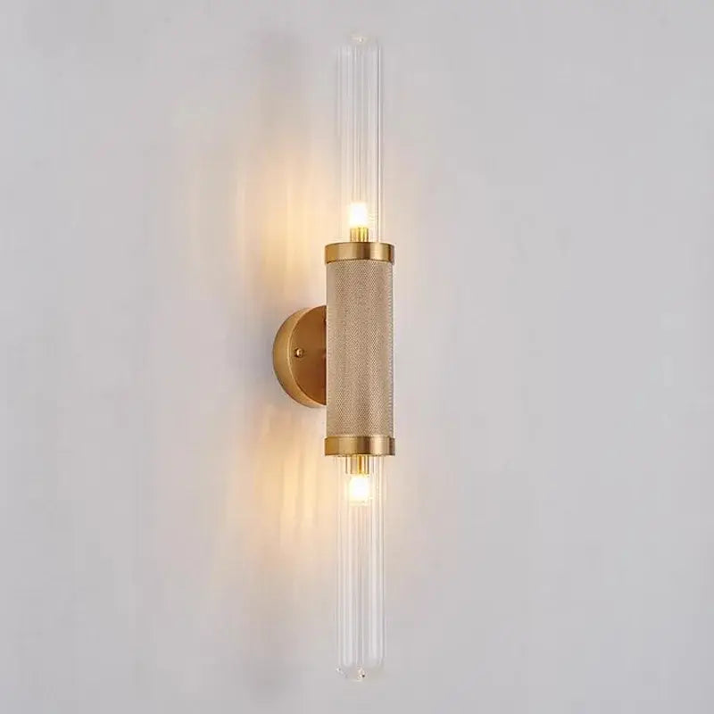 Gold-toned DecorBites glass wall lamp with textured cylindrical iron body and clear glass tubes LED light for home decor and illumination