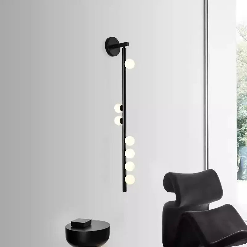 Black modern DecorBites glass wall lamp with slender stem and frosted glass bulbs for hotel villa living room and bedroom