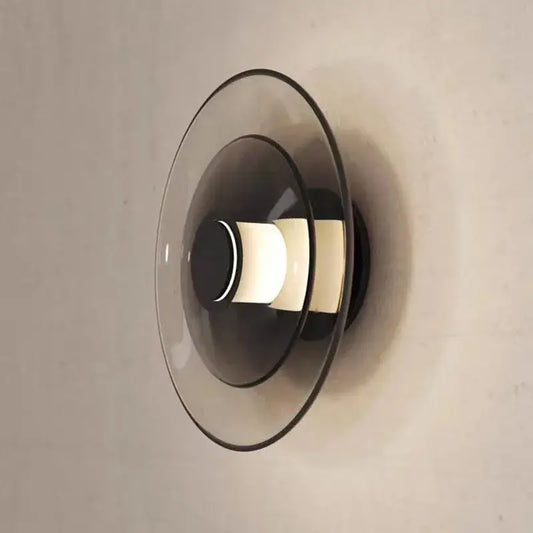 Modern decorbites glass wall lamp with layered translucent glass shades and warm glowing LED for dining or bedroom use