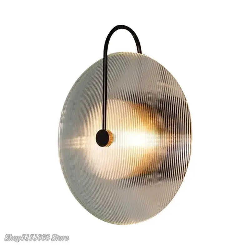 Modern minimalist decorbites glass wall lamp with circular ribbed frosted glass shade and black metal arm for home decor