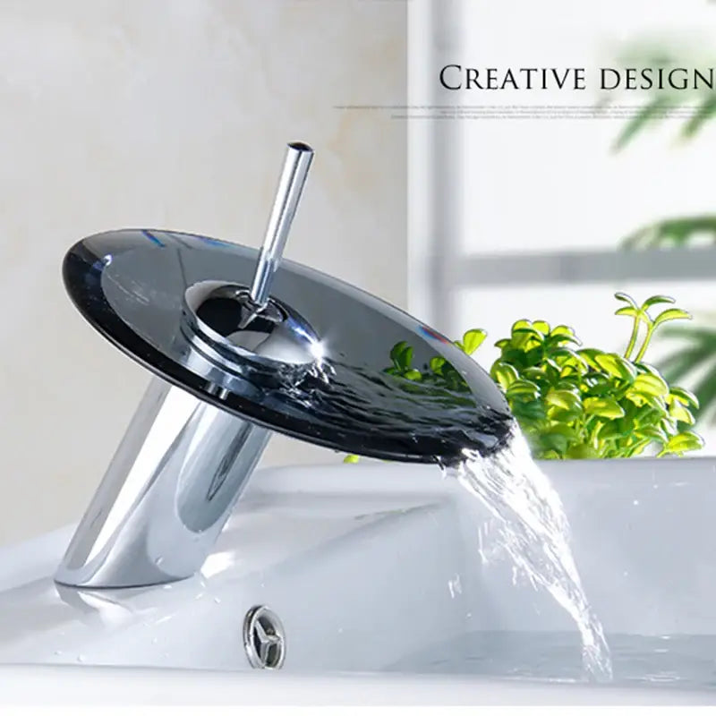 Chrome finished decorbites™ glass waterfall basin sink faucet with sleek circular glass disc spout and modern design
