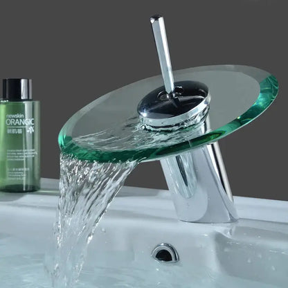 Modern chrome-finished DecorBites™ glass waterfall basin sink faucet with transparent green spout and flowing water