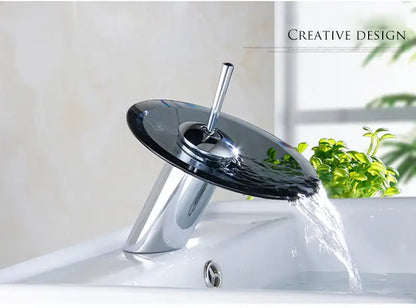 Modern chrome-finished decorbites™ basin sink faucet with sleek transparent black glass waterfall feature