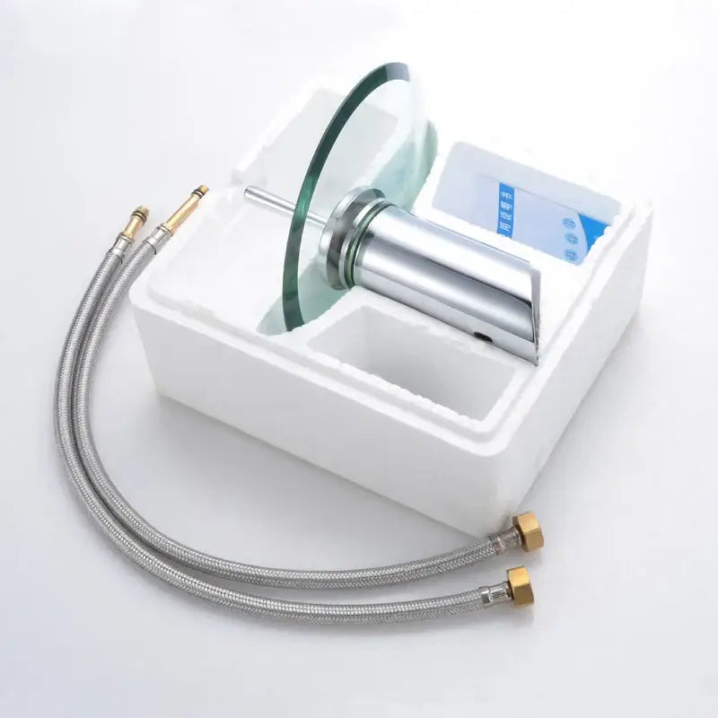 DecorBites glass waterfall basin sink faucet in chrome finish with sleek curved glass disc spout and flexible hoses