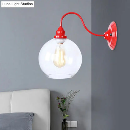 Industrial red metal and glass globe wall light fixture with exposed filament bulb for bedroom lighting