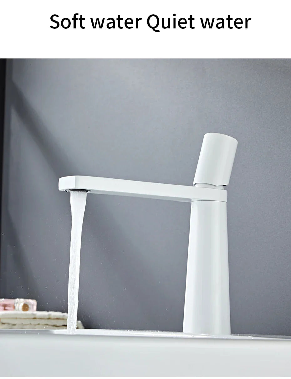 White modern basin faucet with sleek brushed gold brass finish for bathroom sink by decorbites