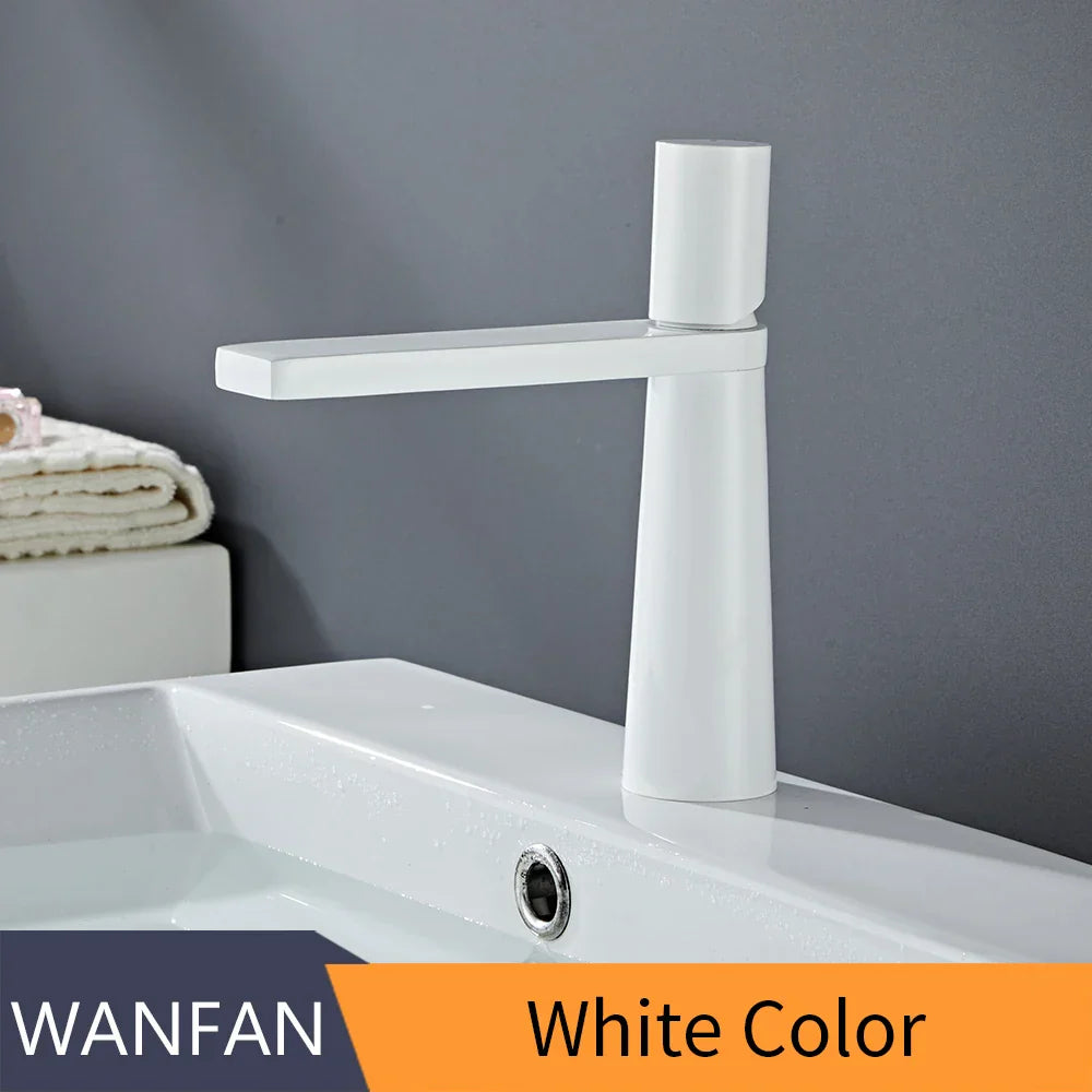 Decorbites™ gold brass basin faucet featuring a white ceramic body with a sleek, modern brushed gold brass finish
