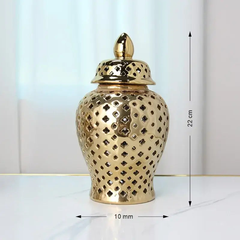 DecorBites gold ceramic carved temple jar with intricate diamond cutouts and matching lid for elegant home decor