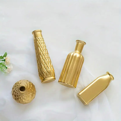 Set of four gold-toned glass vases with varied shapes and textured surfaces for elegant home decor by DecorBites
