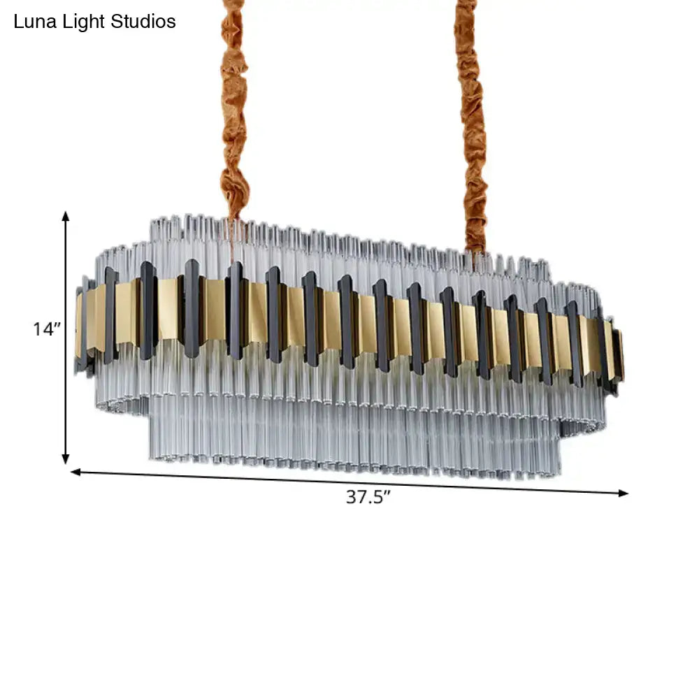 DecorBites gold led island chandelier with clear glass tubes and gold black metal accents suspended by brown cords