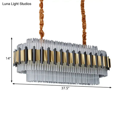 DecorBites gold led island chandelier with clear glass tubes and gold black metal accents suspended by brown cords