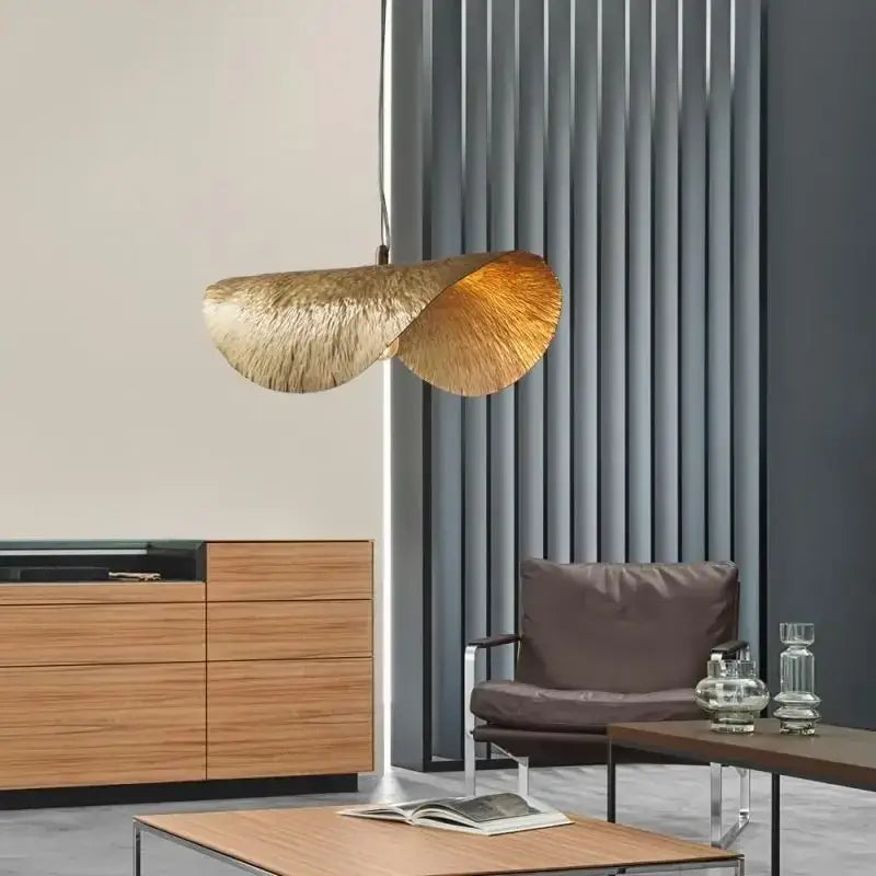 Gold lotus leaf pendant light by decorbites with textured metallic finish in modern LED chandelier design