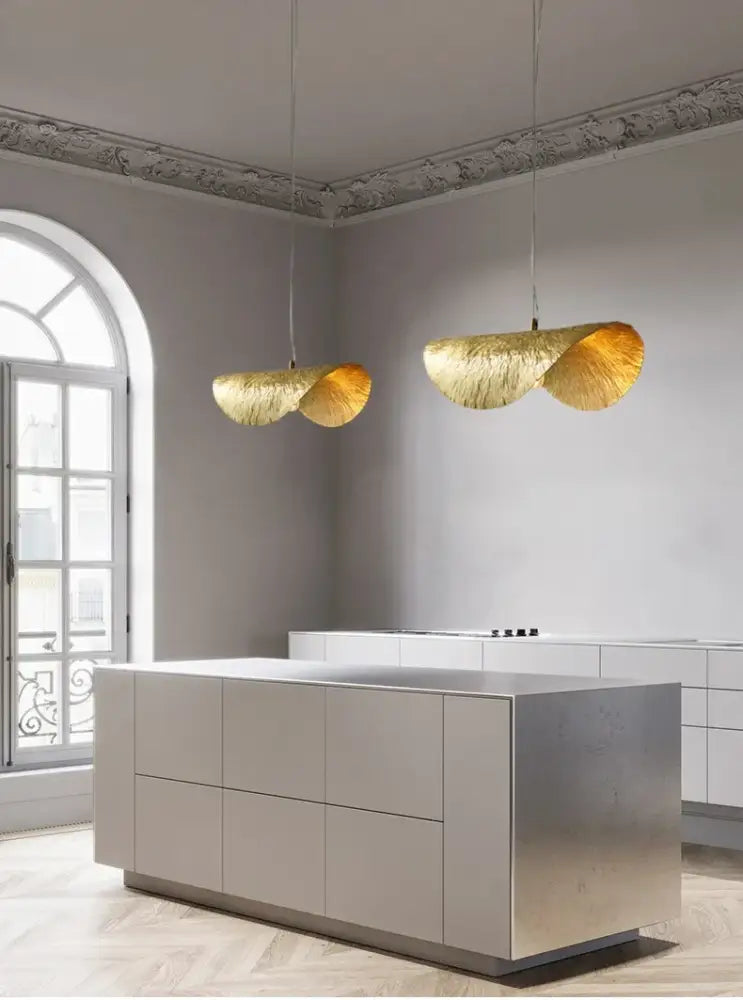 Decorbites gold lotus leaf pendant light features golden textured metallic lotus leaf shaped LED chandelier bulbs hanging