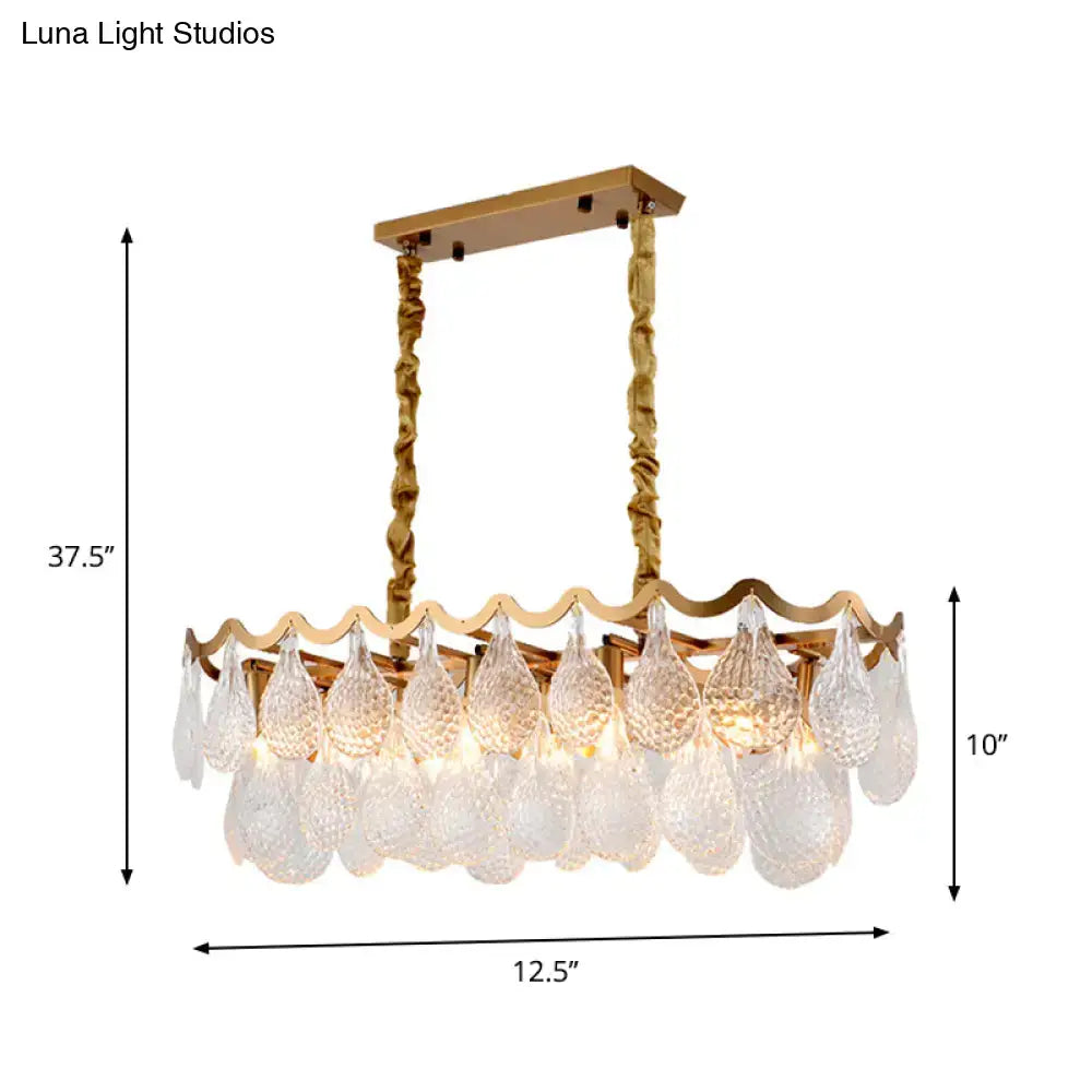 Gold-toned DecorBites island pendant with textured twisted chains and clear K9 crystal teardrop shades for dining room lighting