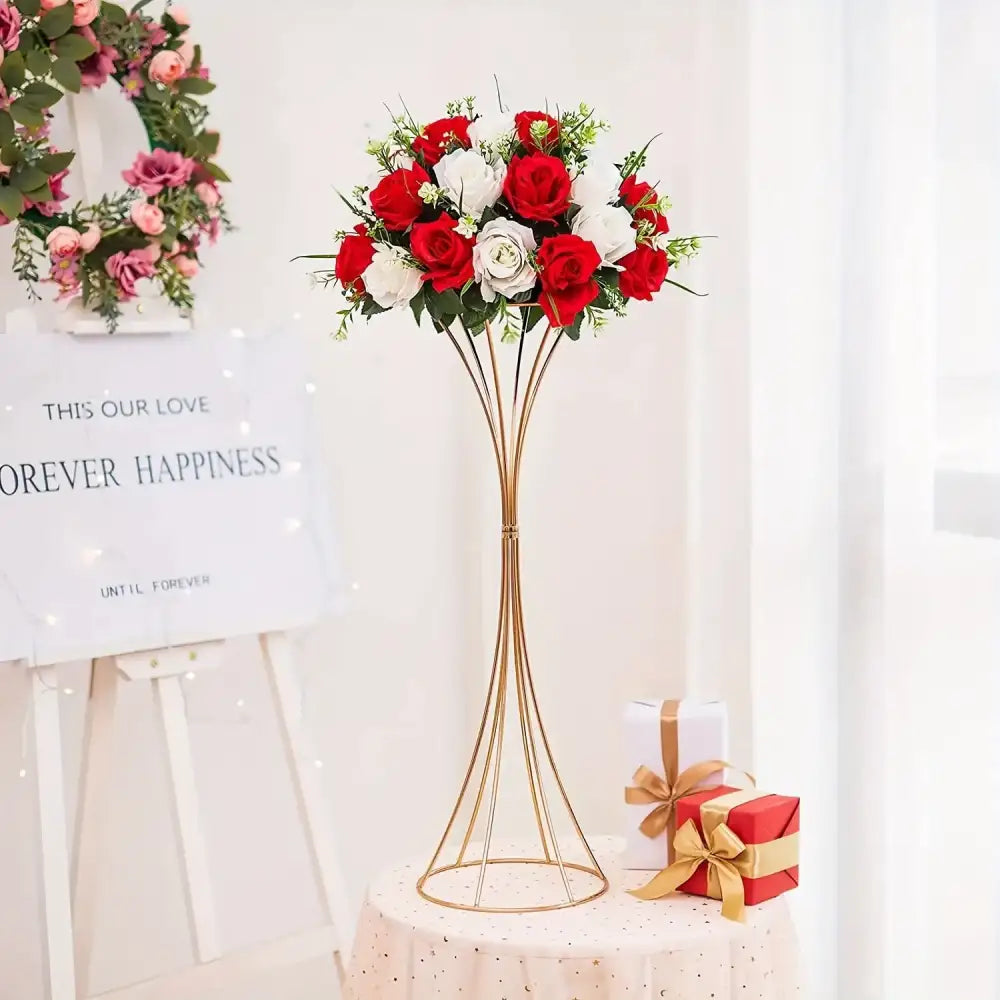 DecorBites gold metal trumpet flower stand with vibrant red and white artificial roses in a slender wire design