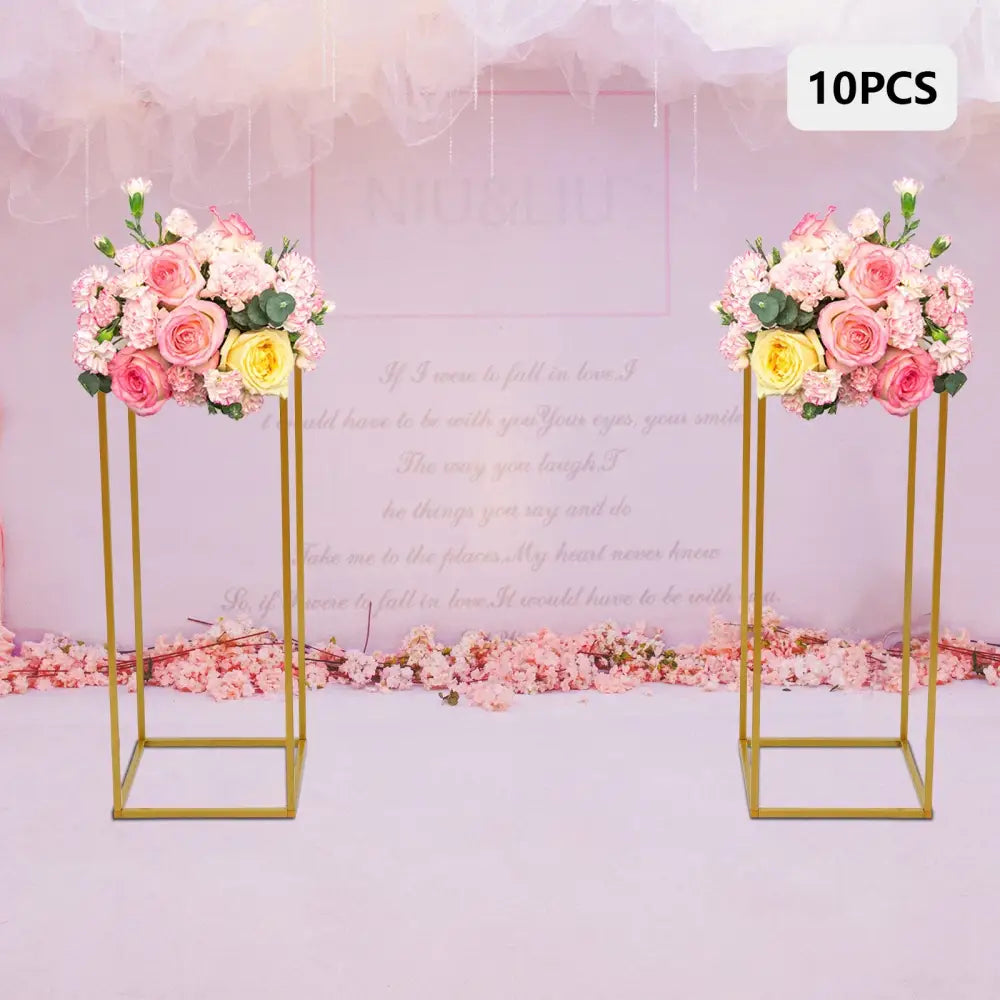 Decorbites gold metal wedding flower stand set featuring gold metal flower stands with pink and yellow roses arranged on top