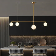 DecorBites™ gold-toned ceiling light with four frosted globe shades for dining room simplicity ball island fixture