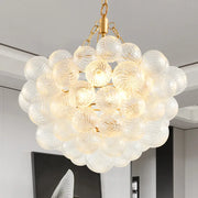 Decorbites gold pendant chandelier with adjustable height featuring translucent bubble glass spheres and gold frame pendant light