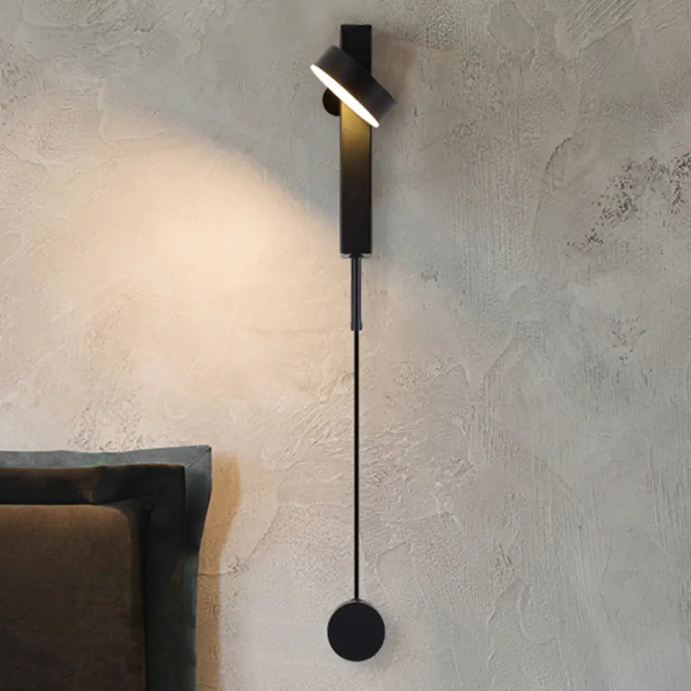 Black DecorBites™ wall lamp with dimmer switch featuring a minimalist design, adjustable head, and slender stem
