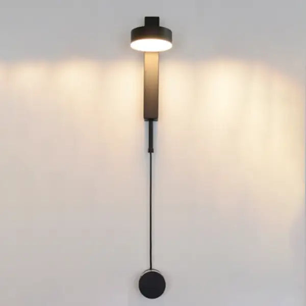 Modern black DecorBites™ wall lamp with cylindrical light head and dimmer switch for sleek, minimalist wall lamps