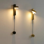 Two minimalist DecorBites gold wall lamps in matte black and brushed brass with dimmer switch and angled light heads