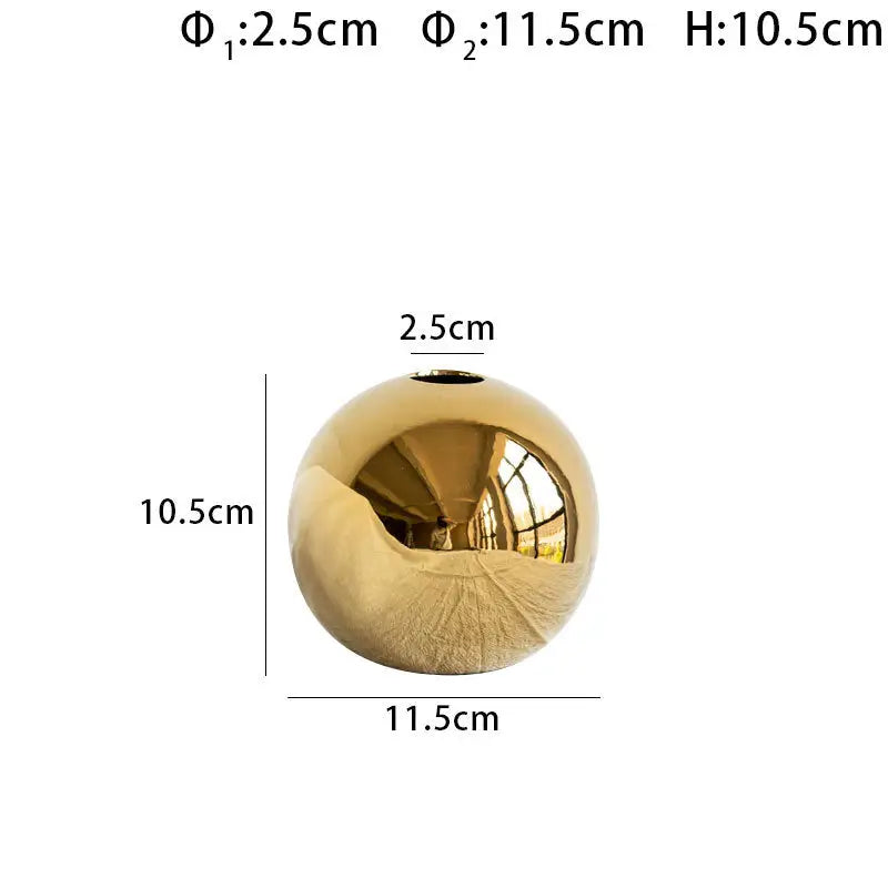 DecorBites golden ball ceramic vase is a shiny gold spherical home decor item with a smooth reflective surface and small opening
