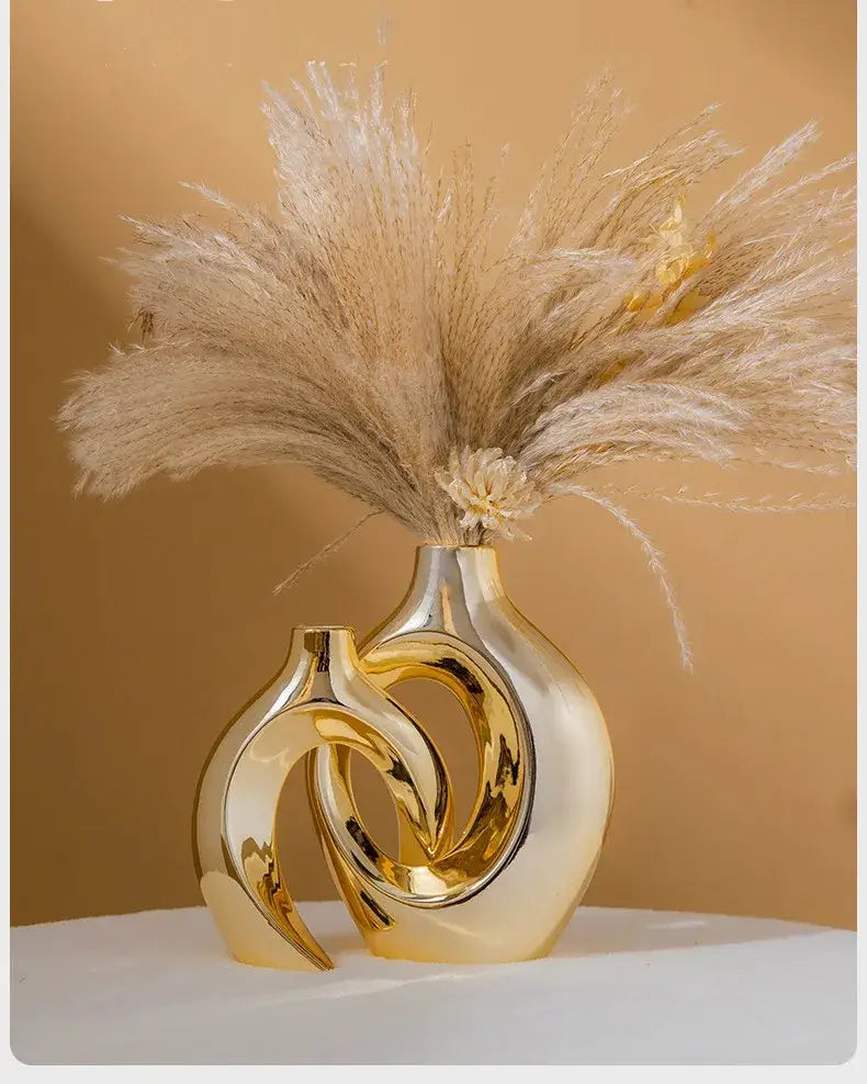 Golden glossy ceramic golden flower vase by DecorBites™ with abstract design holding pampas grass bouquet