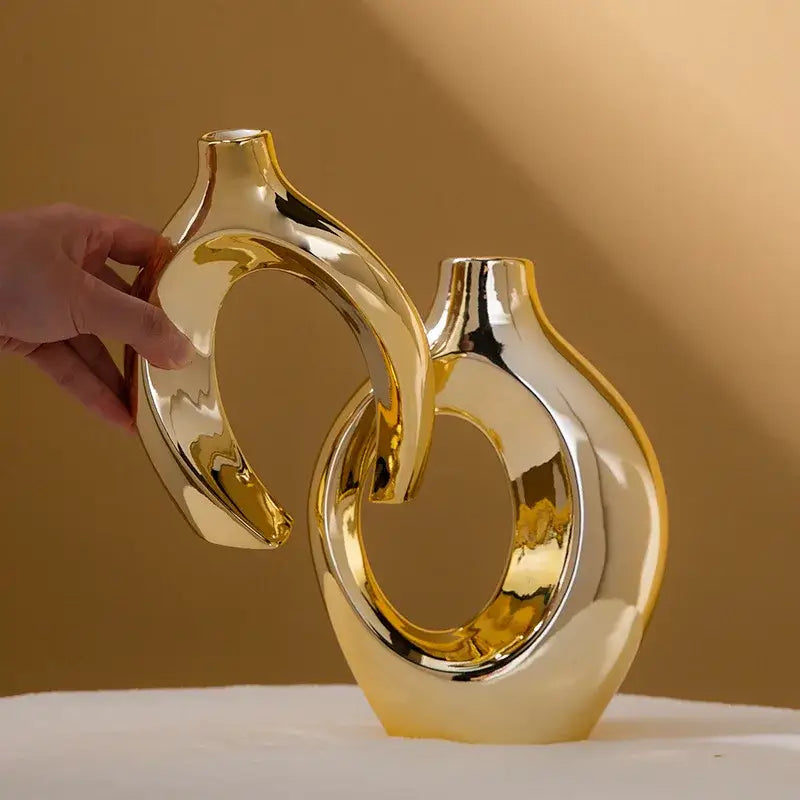 Shiny gold ceramic golden flower vase with sleek modern ring designs from DecorBites home decor accessory collection