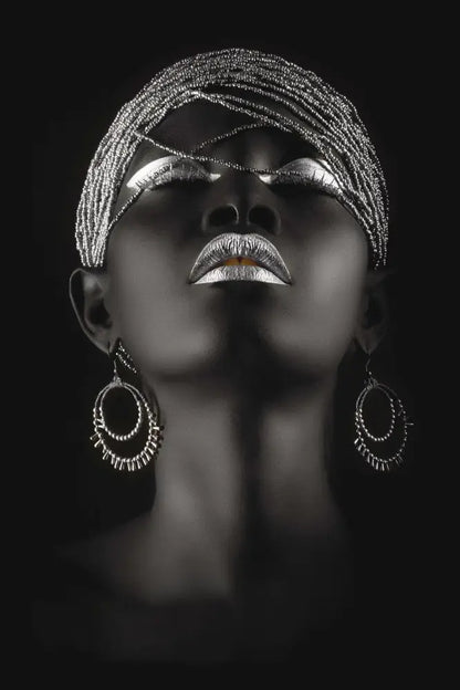 A woman wearing silver beaded headpiece and hoop earrings in decorbites golden jewelry african woman canvas art