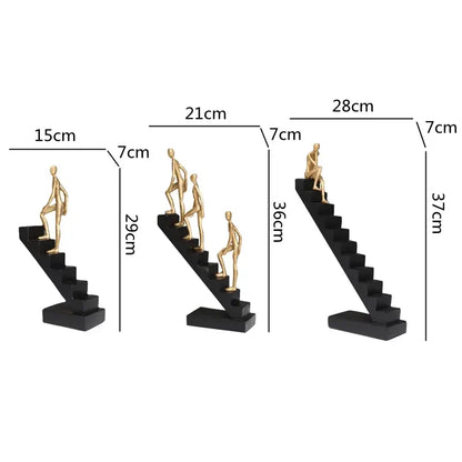 Set of three decorbites golden man climber gold-toned figurines on black stairs for home decor ornaments