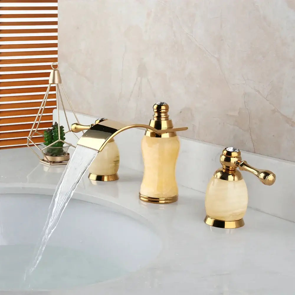 Decorbites golden plated waterfall bathtub faucet with cream onyx handles and crystal accent in gold finish